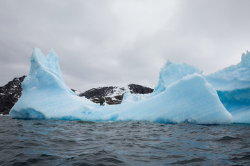 ice in the Antarctica with iceberg in the ocean