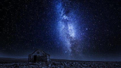Wall Mural - small stone cottage and moving milky way at night, iceland, timelapse, 4k