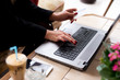 © romul014 - Closeup woman's hands typing on a laptop