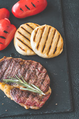 Canvas Print - Grilled beef steak with bell peppers and cheese