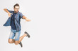 © denis_vermenko - Happy excited cheerful young man jumping and celebrating success isolated on a white background