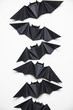 © ink drop - Halloween origami paper dracula bats on a white background