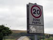 © Stephen Davies - 20 mph speed limit sign on public road, near a school, driving safety