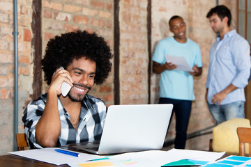 african american hipster software developer at startup company