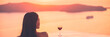 Luxury travel woman drinking red wine glass watching sunset on cruise ship holiday vacation - rich people high end lifestyle banner panorama landscape.