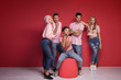 © neonshot - Group of young people posing in pink clothes.