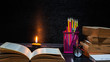 © AungMyo - Book,Accessories,pencils, with lighting candle at night time,Back to School,Education concept,