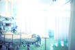 © sudok1 - Bright hospital room with a patient in bed, unfocused background