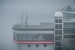 Part of the building complex on the top of Zugspitze in heavy fog