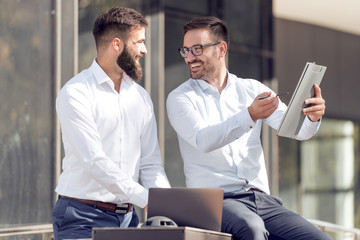 Wall Mural - Business colleagues reading document