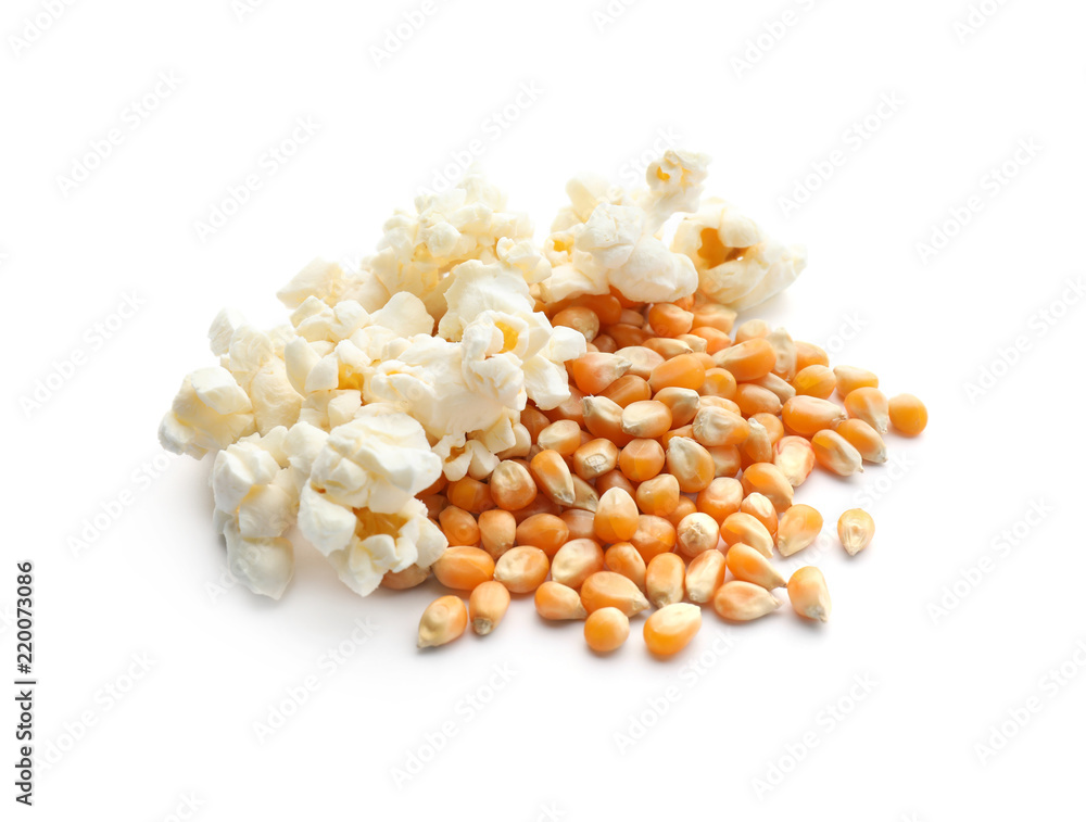 Delicious popcorn and kernels on white background