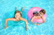 © Pixel-Shot - Cute boys swimming in pool on summer day