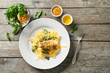 Plate of delicious pasta with chicken fillet and cheese on wooden table