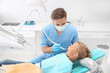 © Pixel-Shot - Dentist filling little boy's teeth in clinic