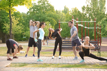 Sticker - Group of sporty people training outdoors