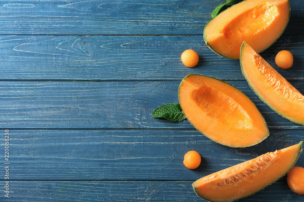 Tasty cut melon on wooden table