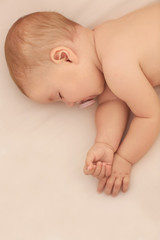 Wall Mural - Cute little baby sleeping on bed