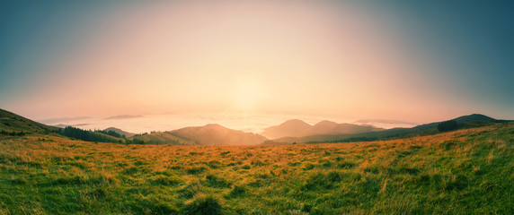 Wall Mural - dawn over the tops of the mountains