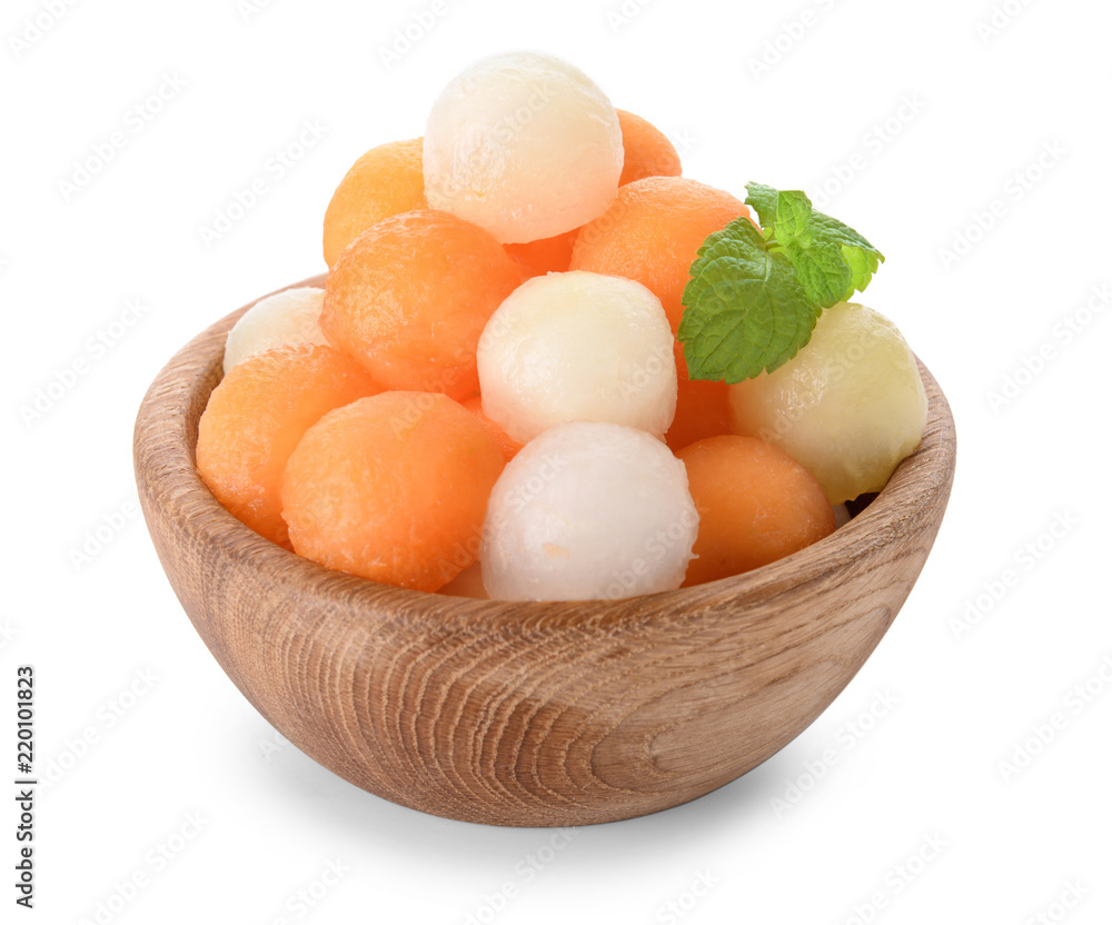 Bowl with tasty melon balls on white background