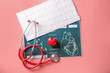 Medical stethoscope, red heart and cardiogram on color background