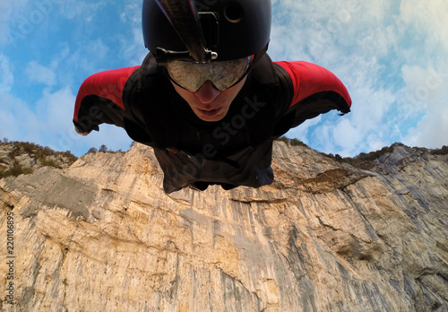 Fotografie, Obraz self-portrait of the base jumper in flight from the cliff, base jumping, wingsui