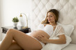 © BGStock72 - Young pregnant woman laying in the bed