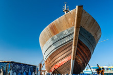 Repairs On The Bow Of A Fishing Boat In Dry Dock At The Port Of Essaouira In Morocco