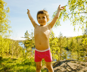 little cute boy on the top of mountain among trees, lifestyle pe