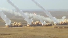 Truck Based Anti Aircraft Missile Launchers Fire In The Desert.