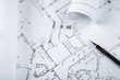 © BillionPhotos.com - Blueprints with a drafting pencil on top of them