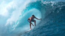 CLOSE UP: Crystal Clear Water Splashes Over Surfer Riding An Epic Barrel Wave.