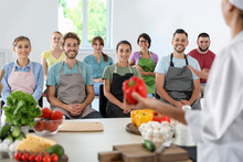 Group Of People And Female Chef At Cooking Classes