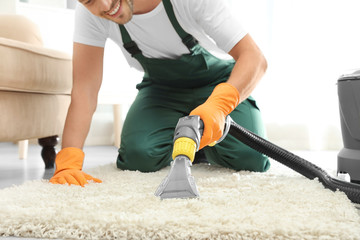 Sticker - Janitor removing dirt from rug with carpet cleaner indoors, closeup