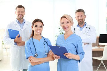 Wall Mural - Doctors and medical assistants in clinic. Health care service