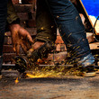 © Malcolm - Man grinding metal with spark flying