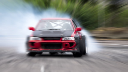 Side view car drifting on track with grain, Sport car wheel drifting and smoking on track.