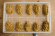 Overhead shot of rows of freshly made pasta.