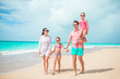 © travnikovstudio - Happy family with kids walk on the beach