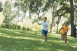 © LIGHTFIELD STUDIOS - cute happy children playing with plane model and running in park