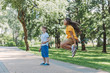 © LIGHTFIELD STUDIOS - adorable happy kids playing and jumping with skipping ropes in park