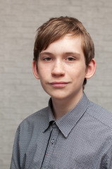 Wall Mural - Portrait of the young Russian man at a brick wall