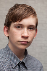 Wall Mural - Portrait of the young Russian man at a brick wall