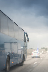 Bus on asphalt road in beautiful spring day at countryside