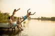 © BGStock72 - Group of young people having fun on pier at the lake
