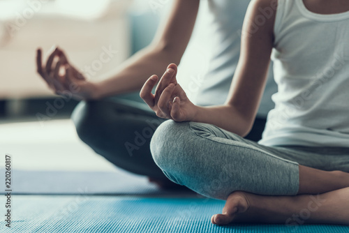 Fotomural Young Woman and Little Girl doing Yoga Pose