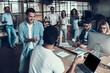 © Vadym Huzhva - Young Smiling Business People at Work in Office