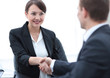 © ASDF - closeup of business woman shaking hands with her colleague.