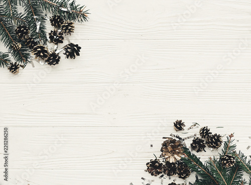 modern christmas layout with green fir branches and golden pine merry christmas layout