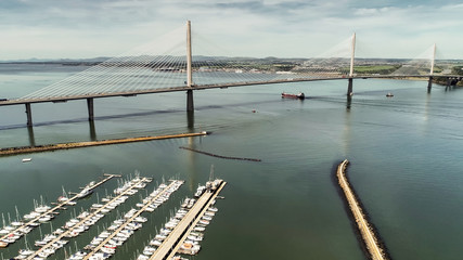 Aerial image looking over the marina at South Queensferry to the new Queensferry Crossing bridge.