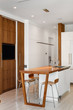 modern white and wood open plan kitchen with breakfast bar and stools